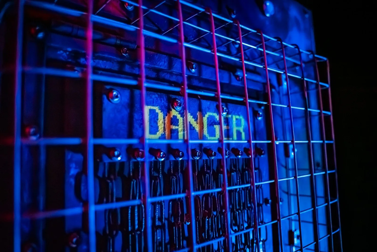A caged Danger panel lit red and blue in Zombie Apocalypse